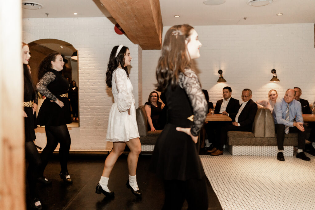 Bride and her dance group perform an Irish dance at Loft at Earls at this downtown Vancouver wedding