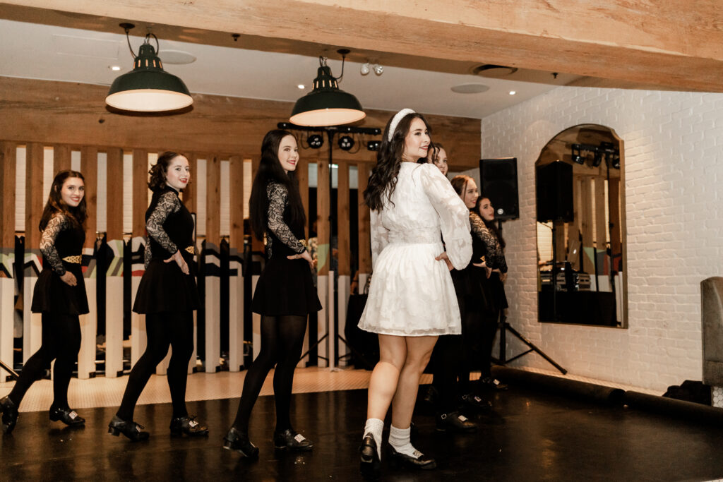 Bride and her dance group perform an Irish dance at Loft at Earls at this downtown Vancouver wedding