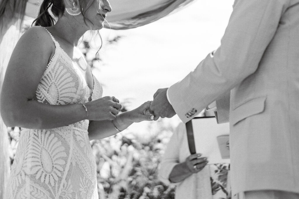 The bride and groom exchange rings at their Kildara Farms wedding