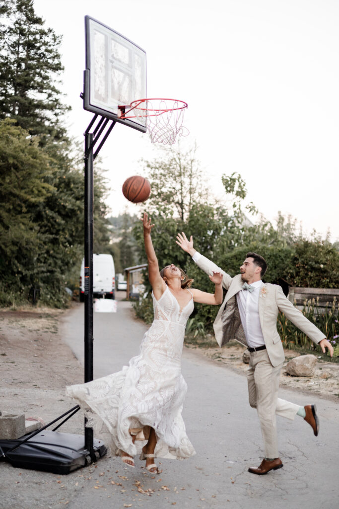 The bride and groom play basketball at their Kildara Farms wedding