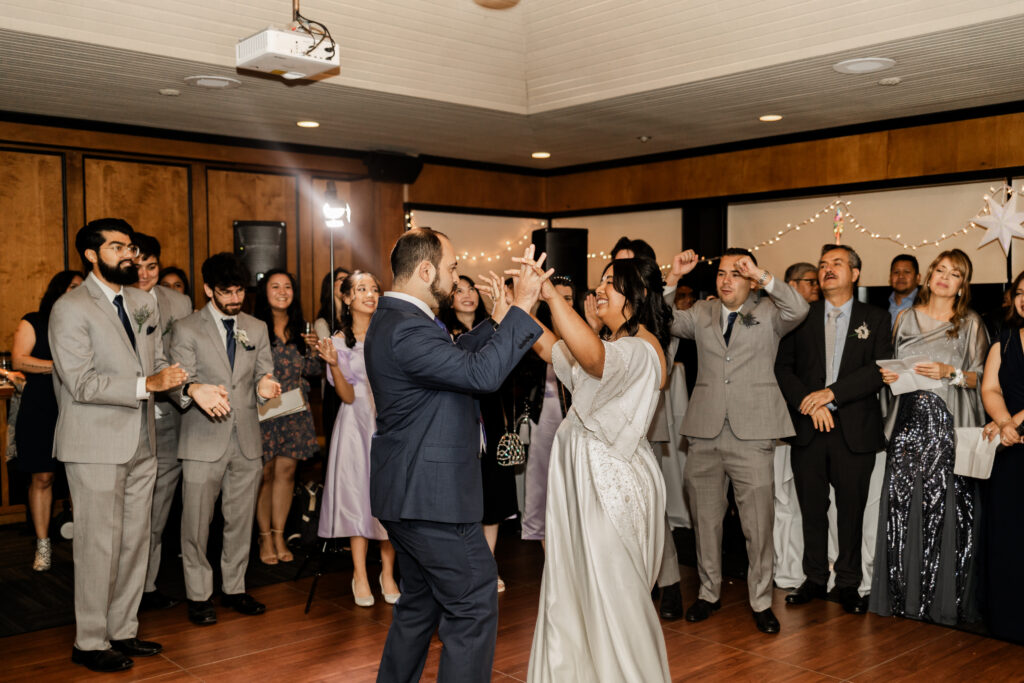 Bride and groom share a dance at this wedding at Seasons Restaurant