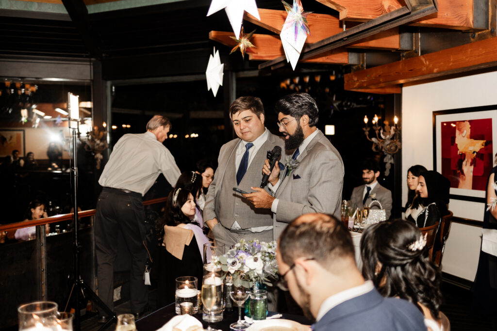 Bridal party members make a speech at this wedding at Seasons Restaurant