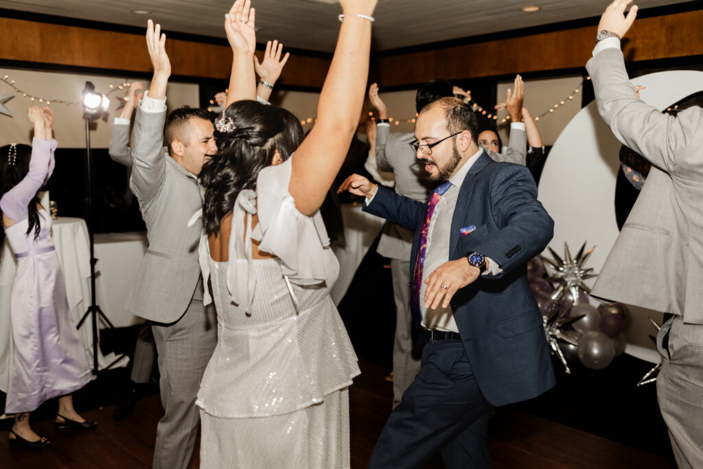 Bride and groom dance together on the dance floor at this wedding at seasons restaurant.