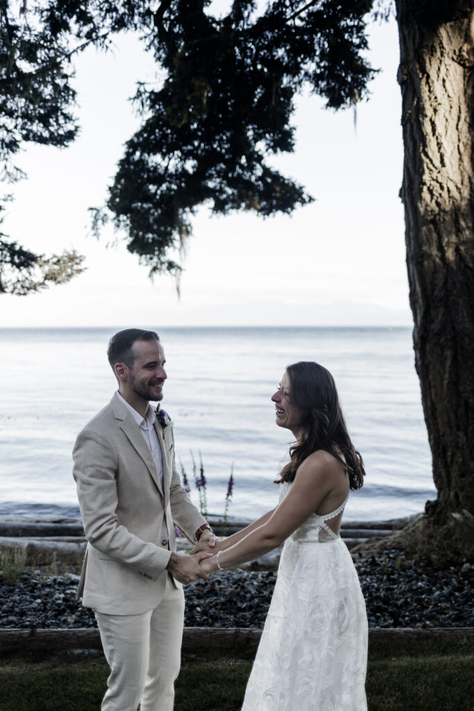 The couple share a laugh immediately after their first kiss at their east sooke elopement.