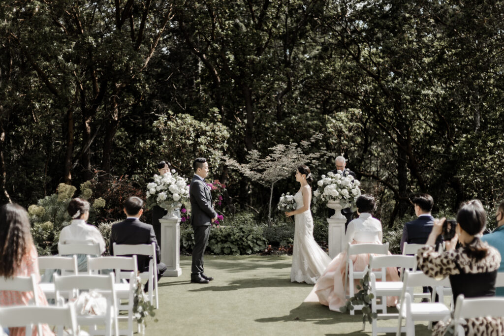 bride and groom stand at the altar at this Olympic View Golf Club wedding