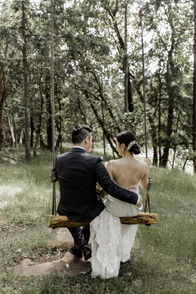 bride and groom on a swing at Olympic View Golf Club wedding