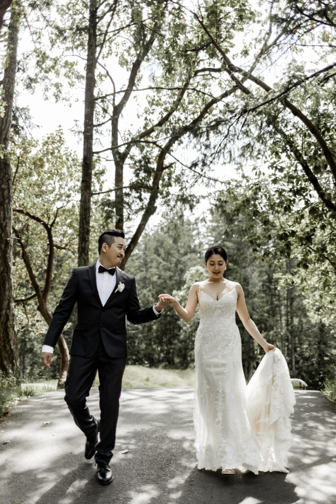 bride and groom walk hand in hand at Olympic View Golf Club wedding