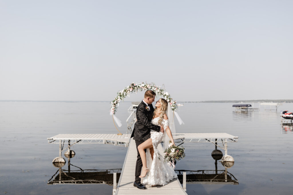 The bride and groom about to kiss at the altar at this lakeside wedding at Alberta Beach