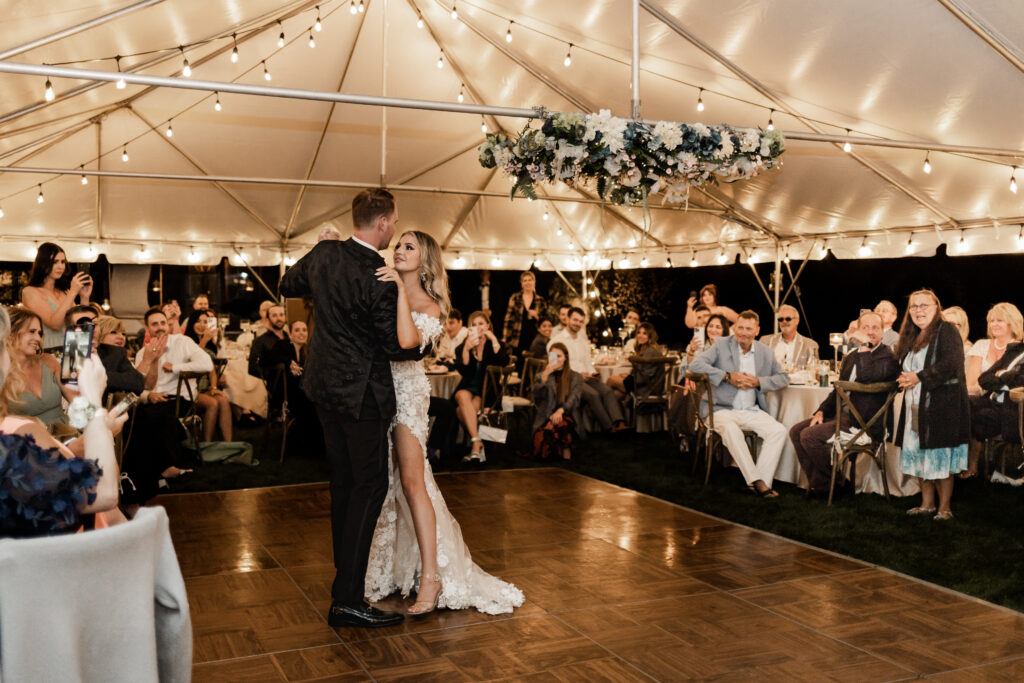 The bride and groom have a first dance at their lakeside wedding at Alberta Beach