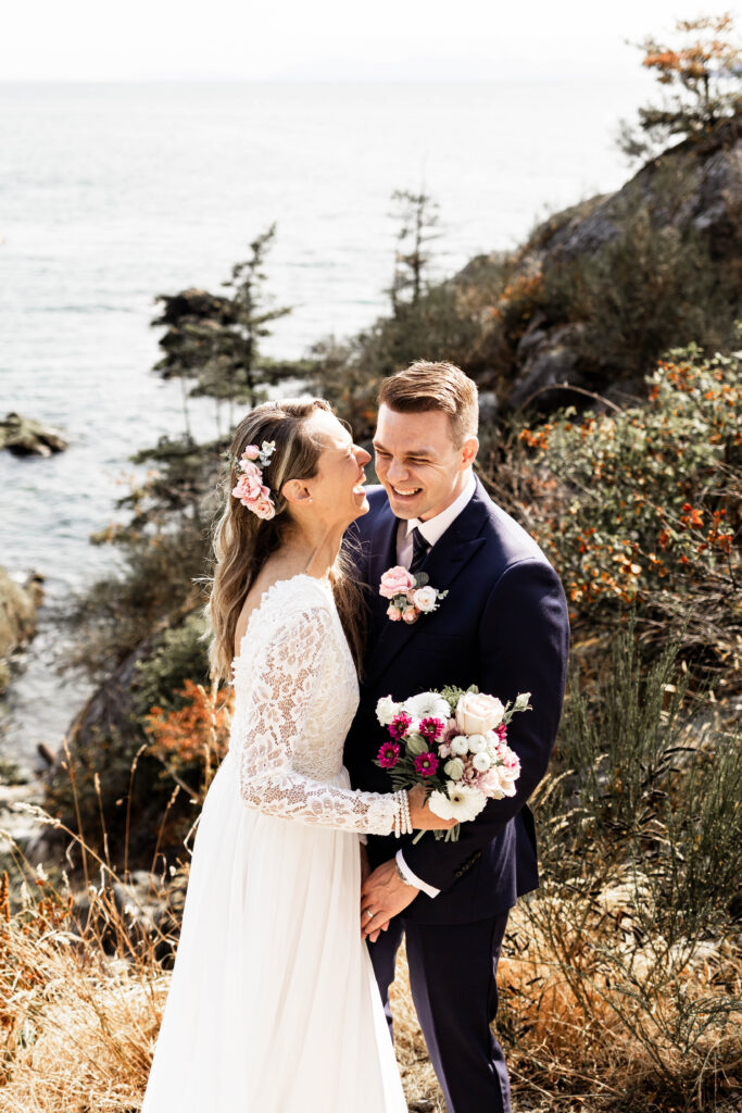 Bride and groom share a laugh at this Whytecliff Park elopement