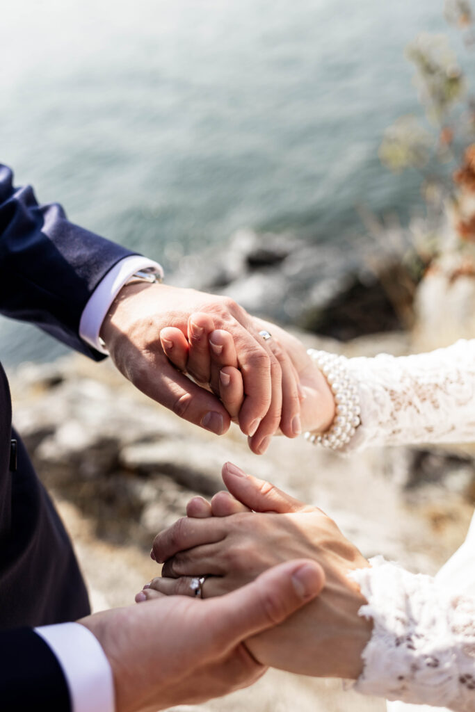 Up close of the couple's rings on their hands at this Whytecliff Park elopement