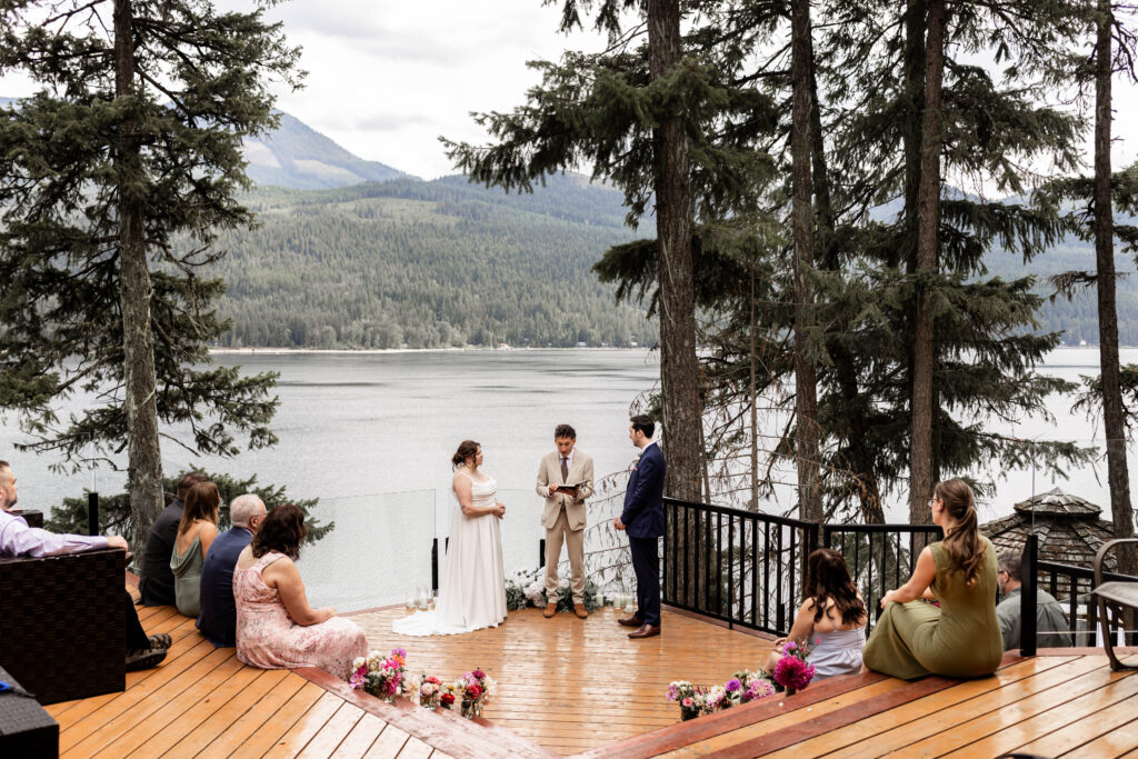 Romantic elopement ceremony on the deck of the cabin, overlooking Mabel Lake.