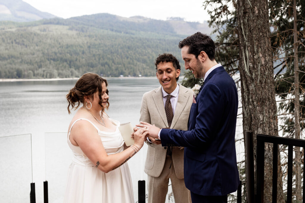 Bride and groom exchange rings at their Mabel Lake elopement