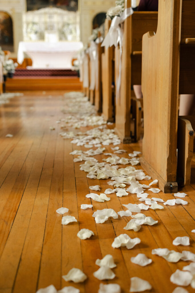 Rose petals lining the aisle at this Victoria cathedral wedding at St. Ann's Academy
