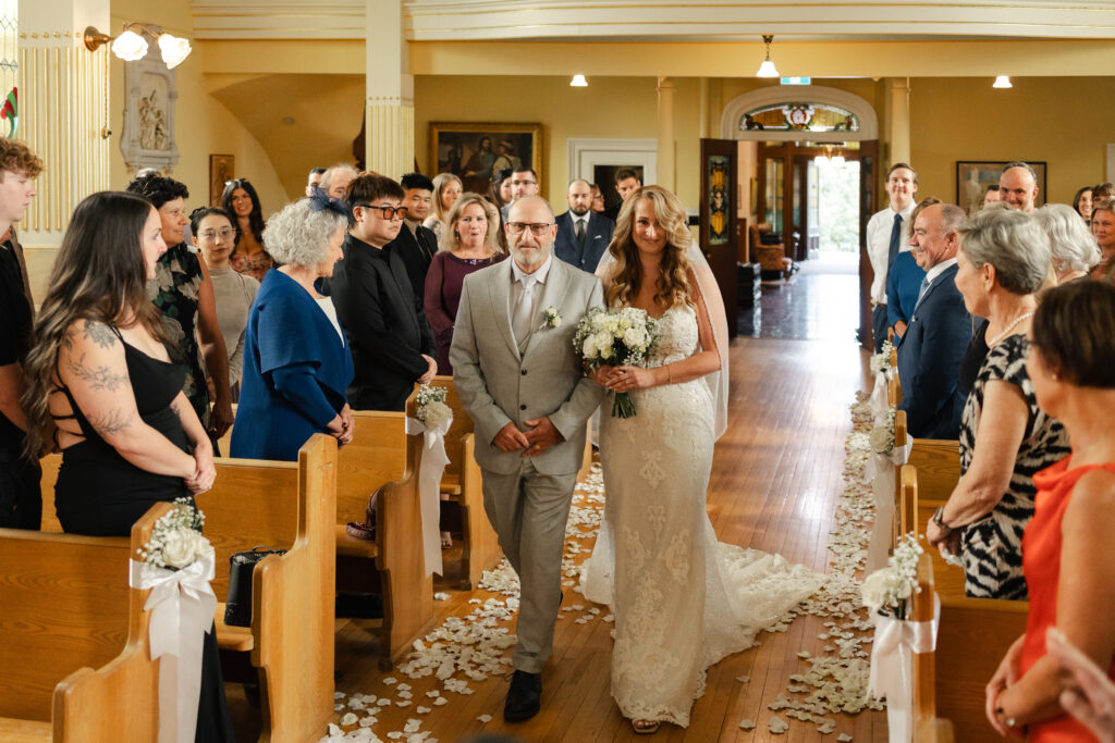 Bride walks down the aisle in her Victoria cathedral wedding at St. Ann's Academy
