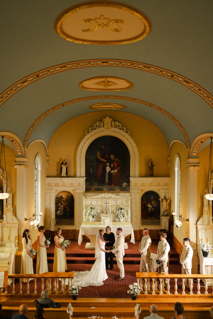 Wide shot of wedding ceremony at St. Ann's Academy at this Victoria Cathedral Wedding.