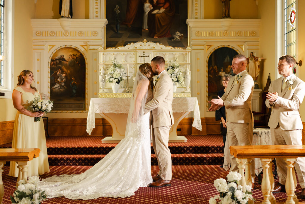Couple shares their first kiss at their Victoria cathedral wedding