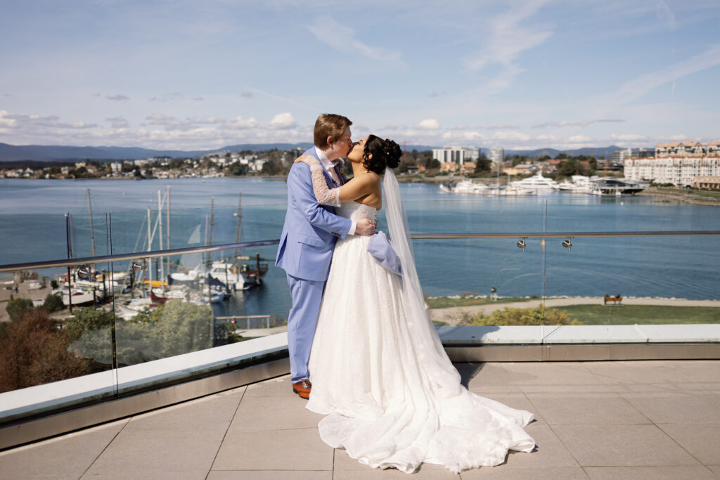 Romantic first look during a sunny Laurel Point Inn wedding in Victoria BC