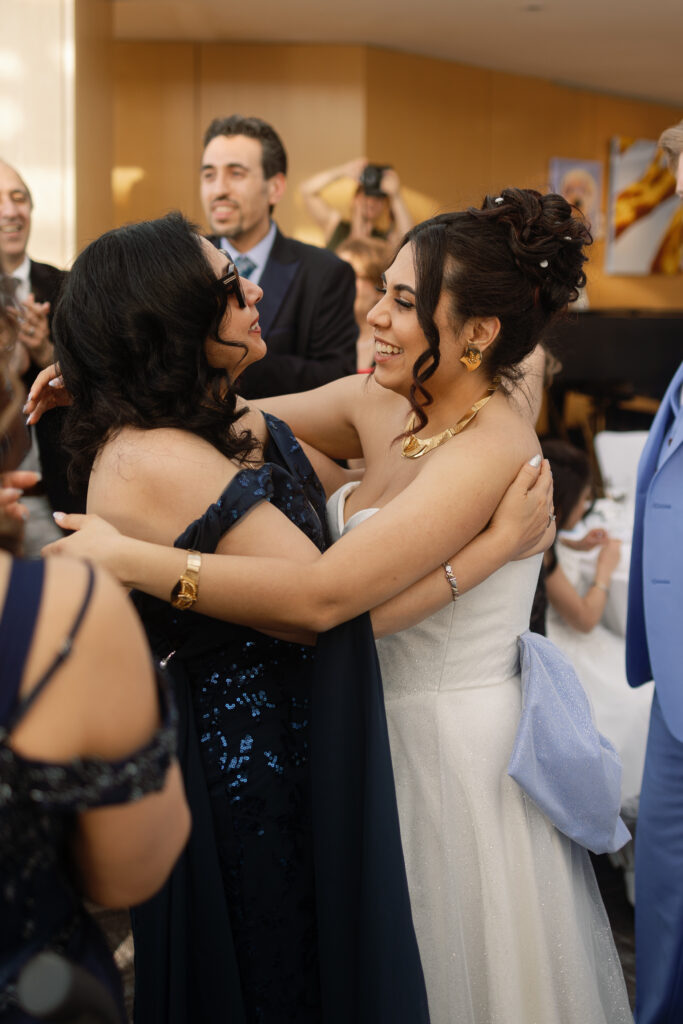 Candid laughter and connection at Laurel Point Inn wedding