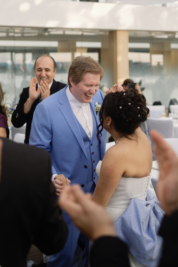 Candid laughter and connection at Laurel Point Inn wedding