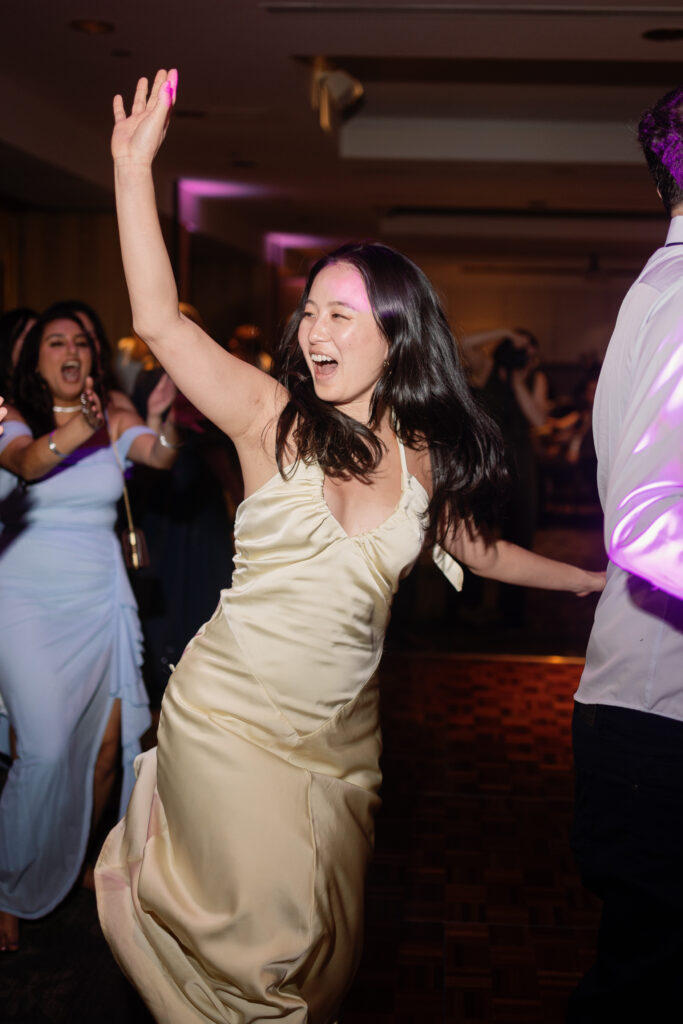 Guests celebrating on the dance floor at Laurel Point Inn wedding
