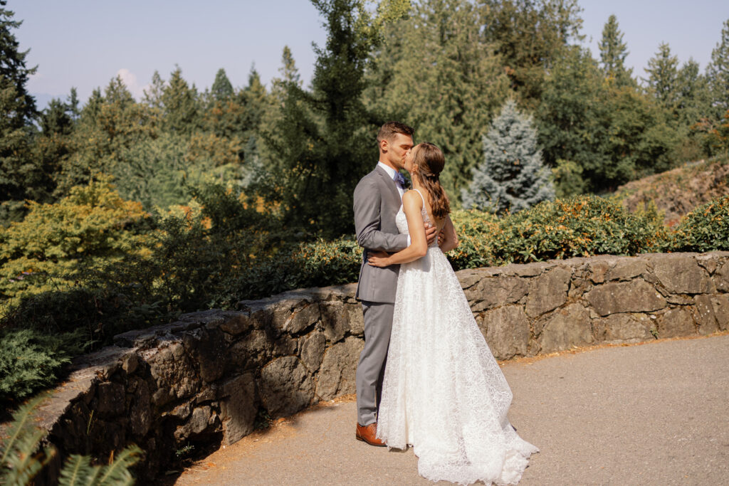 Intimate first look during Queen Elizabeth wedding portraits in Vancouver park setting