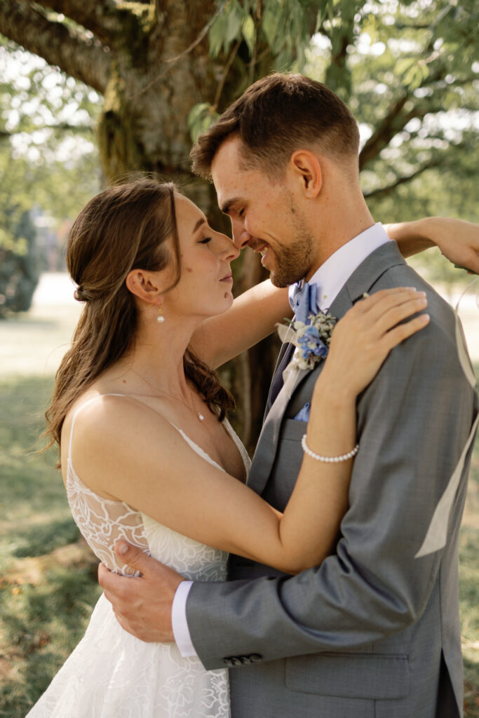 Romantic Queen Elizabeth wedding portraits with bride and groom sharing a quiet moment