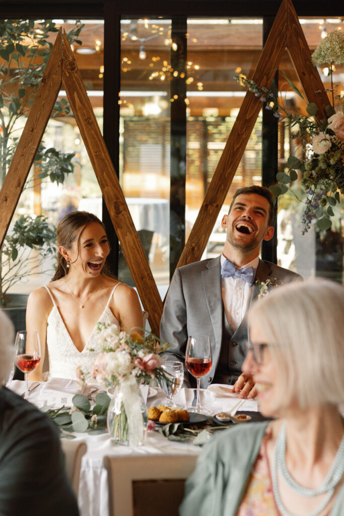Candid moments during a Shaughnessy Restaurant wedding reception with guests laughing and embracing