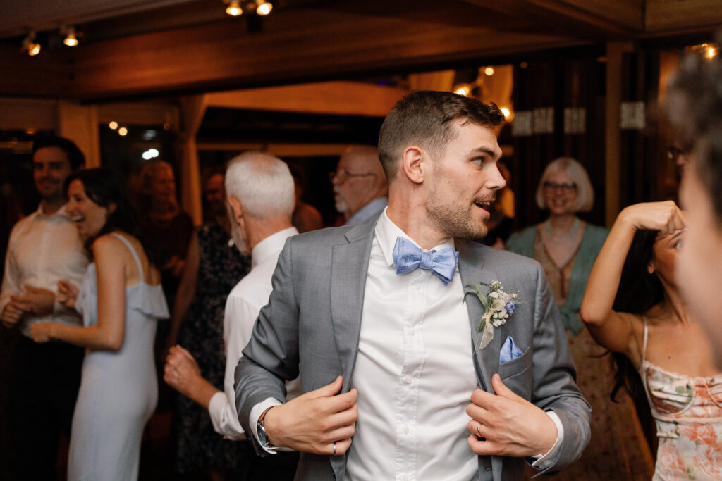 High-energy dance floor at a Shaughnessy wedding reception with packed crowd
